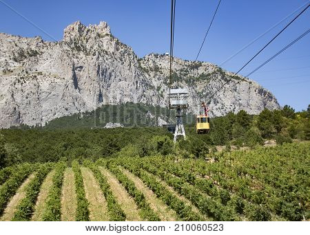 The Cable Car In Crimea Ai-petri On A Background Of Mountains Covered With Clouds
