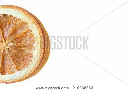 Stack of dried oranges placed to one side on white background