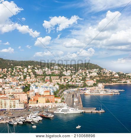 port of Nice and metiterranean sea at summer day under blue sky with cloud, France