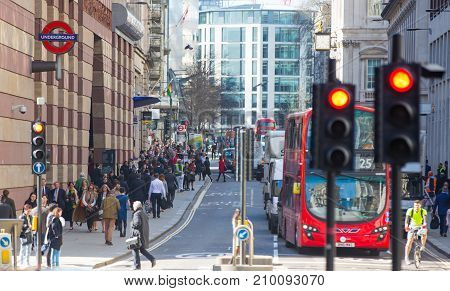 London, UK - March 15, 2017: Busy Bank street in Canary Wharf with lots of traffic and walking people