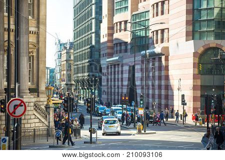 London, UK - March 15, 2017: Walking people in the City of London, Bank street.