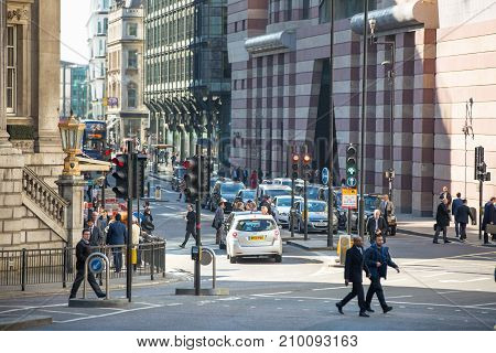 London, UK - March 15, 2017: Walking people in the City of London, Bank street.