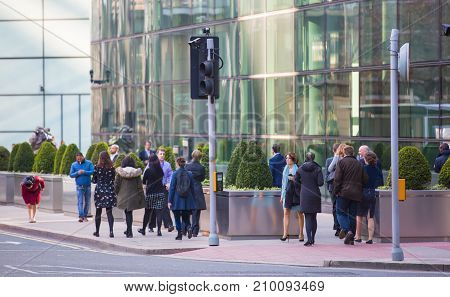 London, UK - March 15, 2017: Walking people in the City of London, Bank street.