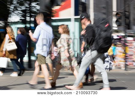 LONDON, UK - June 9, 2017: Blurred image of walking people at Oxford street, the main destination for shopping at Westend.