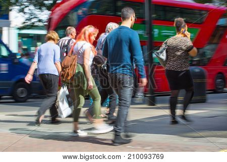 LONDON, UK - June 9, 2017: Blurred image group of walking people at Oxford street, the main destination for shopping at Westend.