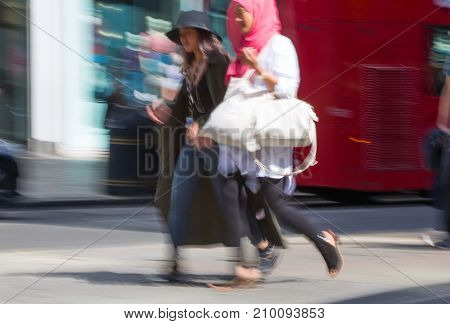 LONDON, UK - June 9, 2017: Blurred image of walking people at Oxford street, the main destination for shopping at Westend.