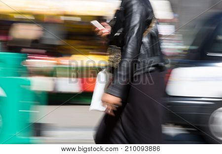 LONDON, UK - June 9, 2017: Blurred image of walking people at Oxford street, the main destination for shopping at Westend.