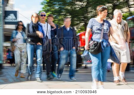 LONDON, UK - June 9, 2017: Blurred image group of walking people at Oxford street, the main destination for shopping at Westend.