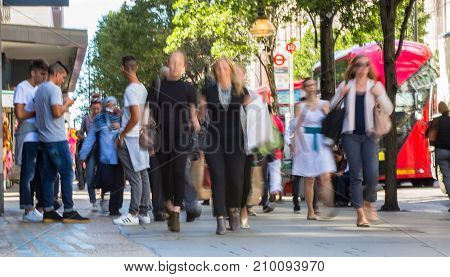 LONDON, UK - June 9, 2017: Blurred image group of walking people at Oxford street, the main destination for shopping at Westend.