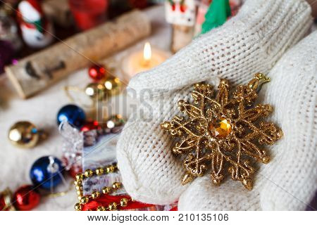A Composition Of Christmas Toys And Hands With Mittens
