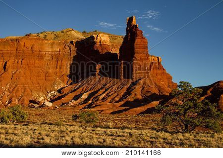 Close-up of iconic Chimney Rock in Capitol Reef National Park in Utah at sunset.