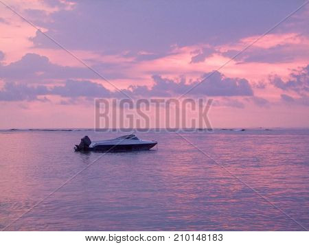 boat near Gili Air wich is part of the Gili Islands in Indonesia at evening time
