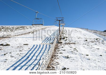 Chair lift in Navacerrada Ski Resort Navacerrada Mountain Pass Madrid Spain on January 4 2015.