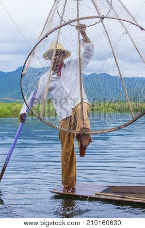 INLE LAKE MYANMAR - SEP 07 : Burmese fisherman at Inle lake Myanmar on September 07 2017 inle Lake is a freshwater lake located in Shan state