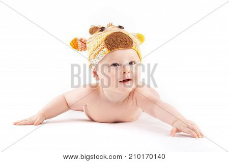 Attractive Cute Baby Boy In Deer Costume Lies On Tummy