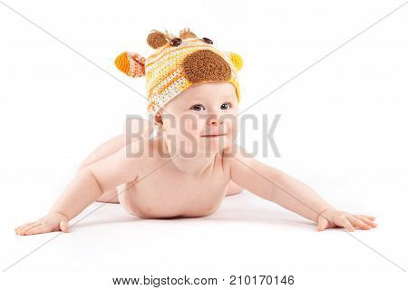 Attractive Cute Baby Boy In Deer Costume Lies On Tummy