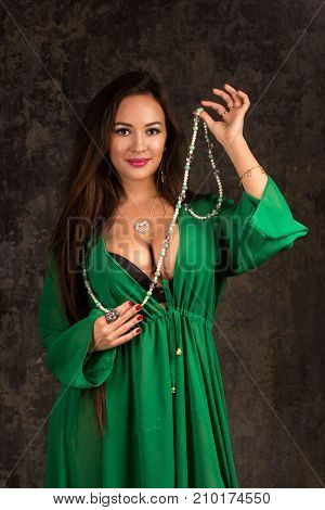 Beautiful Woman In Green Abaya.