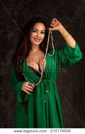 Beautiful Woman In Green Abaya.