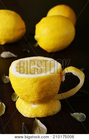 A cup of lemona cup of lemon on a wooden table