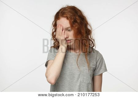 Disappointed Stressed Out Redhead Female Making Facepalm Gesture With Hand. Face Palm Concept