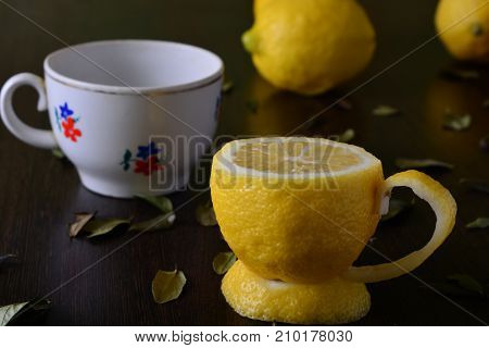 A cup of lemona cup of lemon on a wooden table