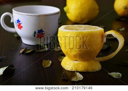 A cup of lemona cup of lemon on a wooden table