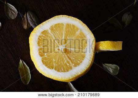 A cup of lemona cup of lemon on a wooden table