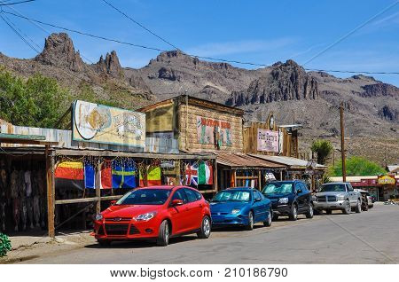 Oatman, Arizona, USA - May 14, 2013 : The unique and nostalgic atmosphere in Oatman on the historic Route 66, showing the contrast between modern cars and the antique architecture of the city.