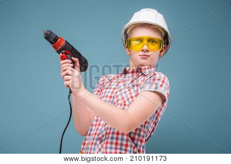 Bewildered Teenager With A Screwdriver In The Hands Of Uncontrollable