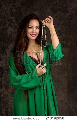 Beautiful Woman In Green Abaya.