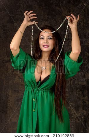 Beautiful Woman In Green Abaya.