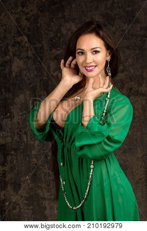 Beautiful Woman In Green Abaya.
