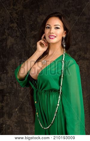 Beautiful Woman In Green Abaya.