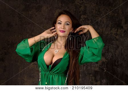 Beautiful Woman In Green Abaya.