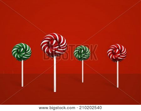 Colorful lollipops Minimal concept Classic round red-white and green-white candy on a stick are standing upright on red background Trendy style photo Front view