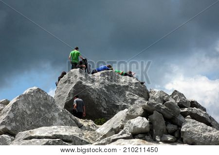 A group of young mountaineers resting on top of mountain Risnjak in national park Risnjak in Croatia