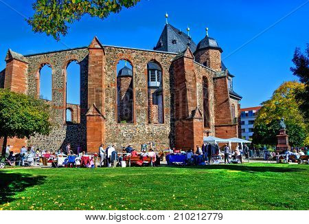 HANAU, GERMANY-OCTOBER 14, 2017: Colorful Flea Market in front of the Anti-War Memorial Church on a sunny October day
