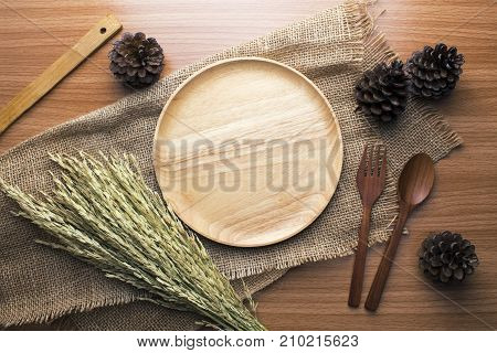 food wooden dinner dish and spoon, fork and decor top view