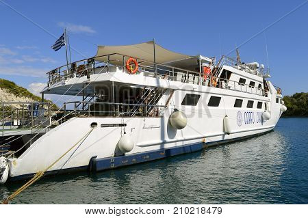 Antipaxos Greece - October 01 2017 : Corfu cruises ferry in Antipaxos harbour ready to sail to Corfu