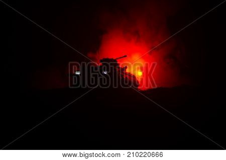Silhouette Armored Personnel Carrier Vehicle On Dark Orange War Fire Background. Selective Focus