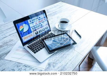 Stock market trading and research software on a Tablet PC with a Laptop computer.