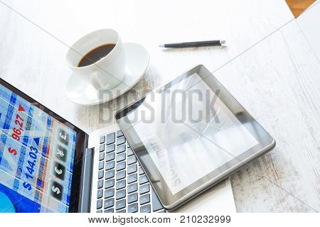 Stock market trading and research software on a Tablet PC with a Laptop computer.