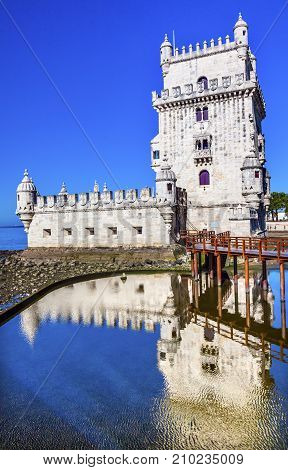 Belem Tower Torre de Belem Portuguese Symbol of Exploration Reflection Lisbon Portugal. Belem Tower was constructed in early 1500s on Tagus River and last point Portguese explorers saw when left Lisbon.