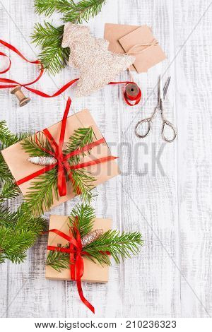 Christmas Decoration. Gift Wrapping And Decorating Christmas Present, Boxes In Craft Paper With Sati