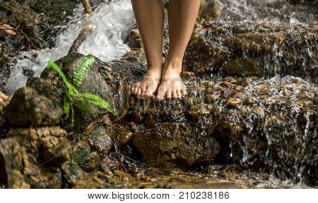 Bare Female Feet On The Water