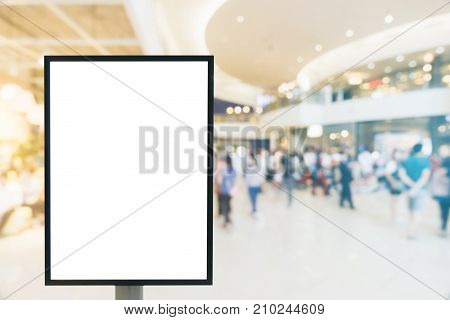 Blank mock up of vertical poster billboard sign with copy space for your text message or content in modern shopping mall. Blank mock up of vertical street poster billboard department store background.