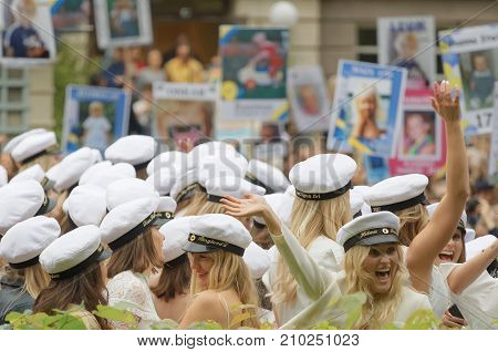 Stockholm Sweden - Jun 13 2017: Happy Swedish Graduating Teenagers Waving Funny Posters In The Backg