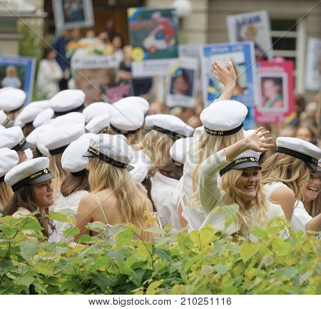 Stockholm Sweden - Jun 13 2017: Happy Swedish Graduating Teenagers Waving Funny Posters In The Backg