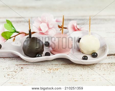 delicious chocolate balls in ceramic plate .