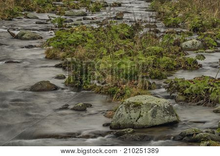 Upa River In Velka Upa Village In Krkonose Mountains With Color Autumn
